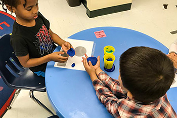 Woodland Acres students learning with play-doh